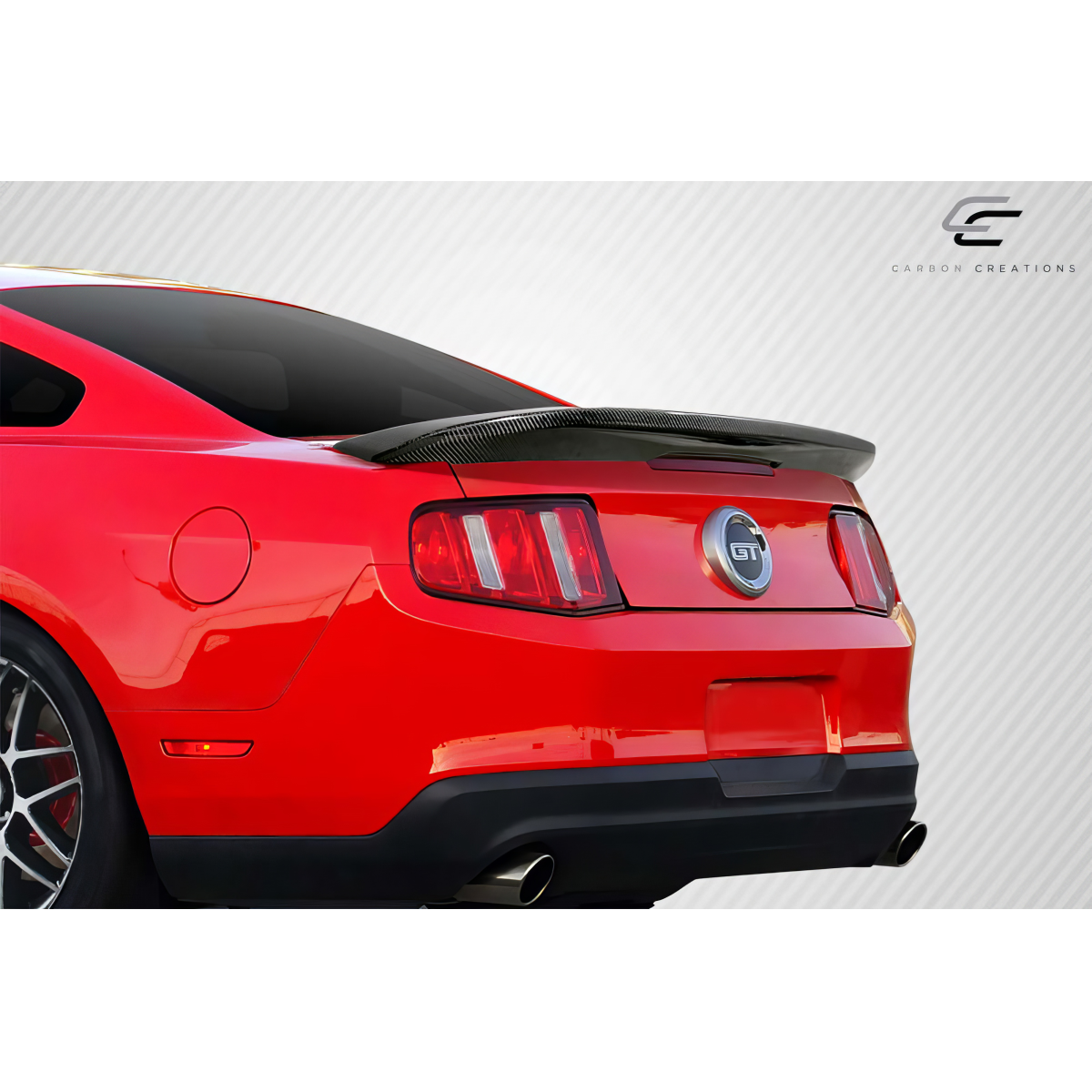 Modify your Ford Mustang 2010 with our Exterior/Wings - Rear angle view highlighting carbon fiber wing