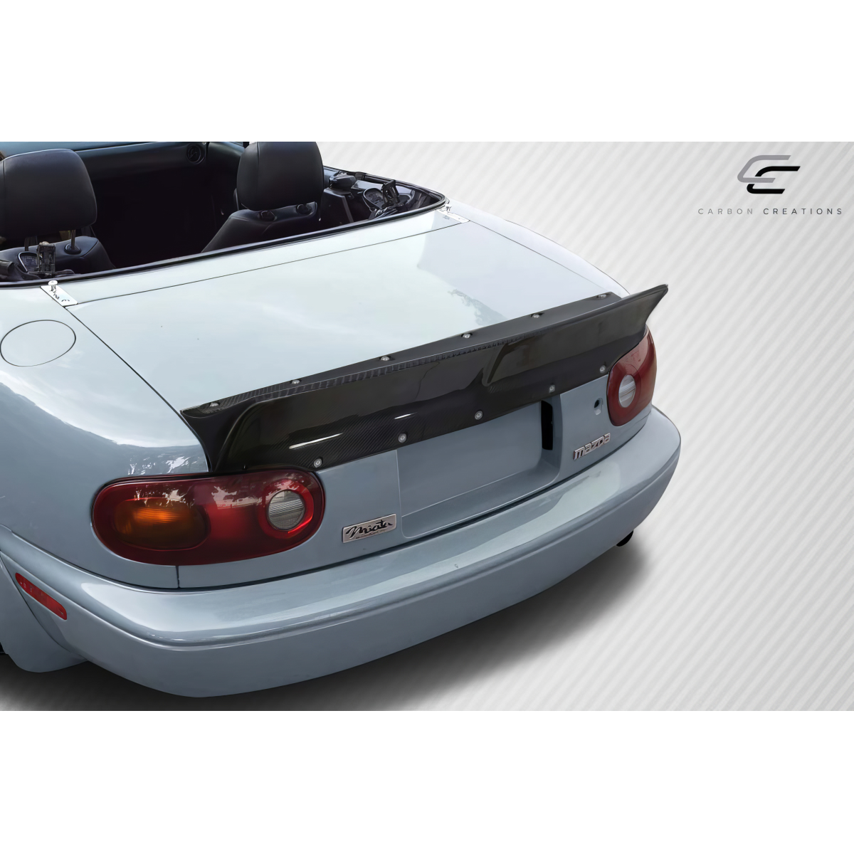 Modify your Mazda Miata 1990 with our Exterior/Wings - Rear view at a slight upward angle showing the wing