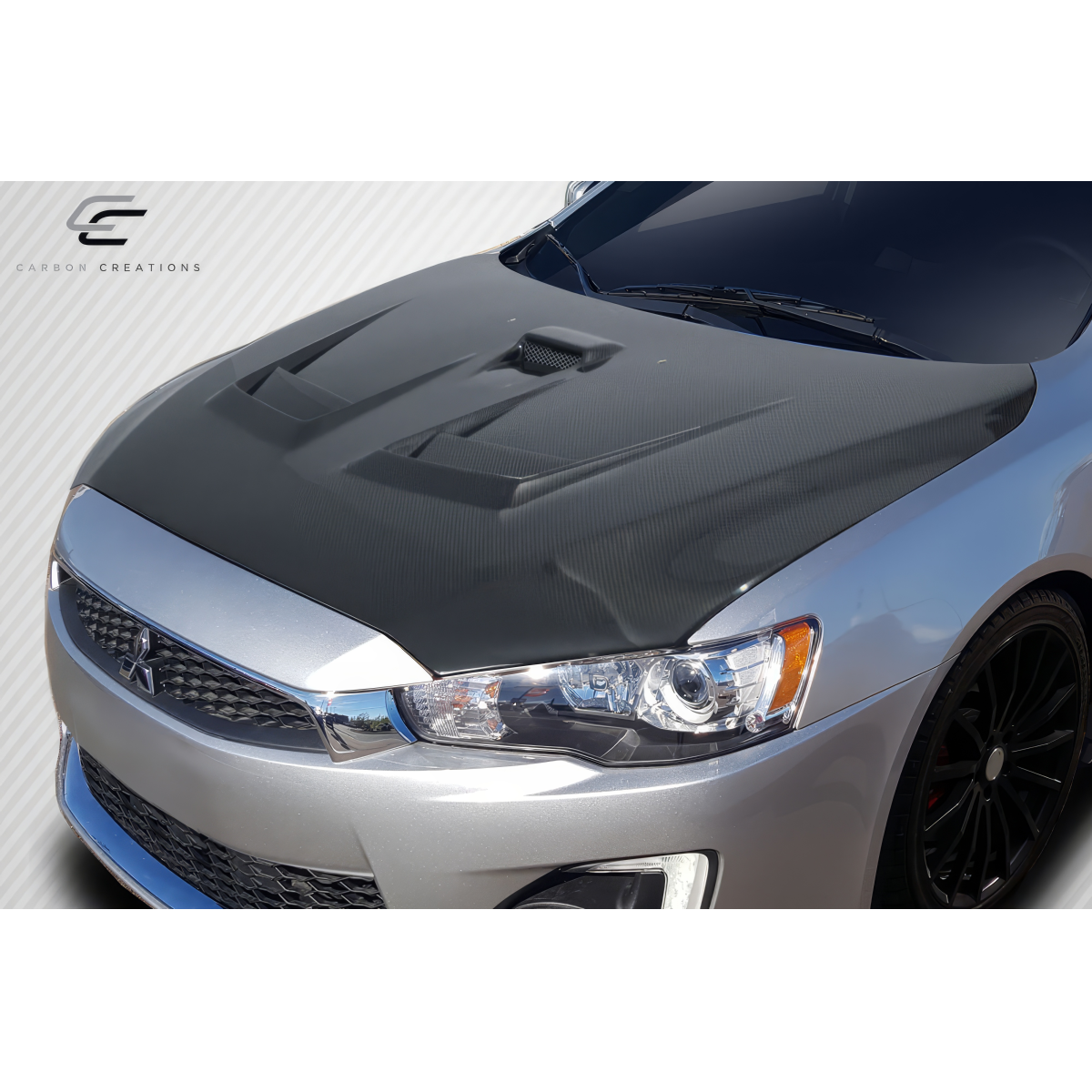 Modify your Mitsubishi Evolution 2008 with our Exterior/Hoods - Top view of the hood at a slight angle