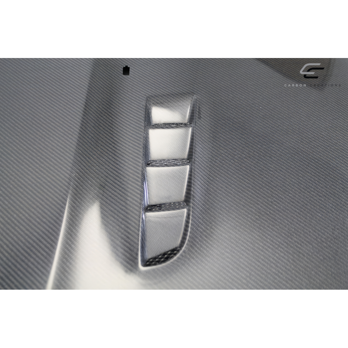 Modify your Ford Focus 2016 with our Exterior/Hoods - Angled side view of carbon fiber hood vent