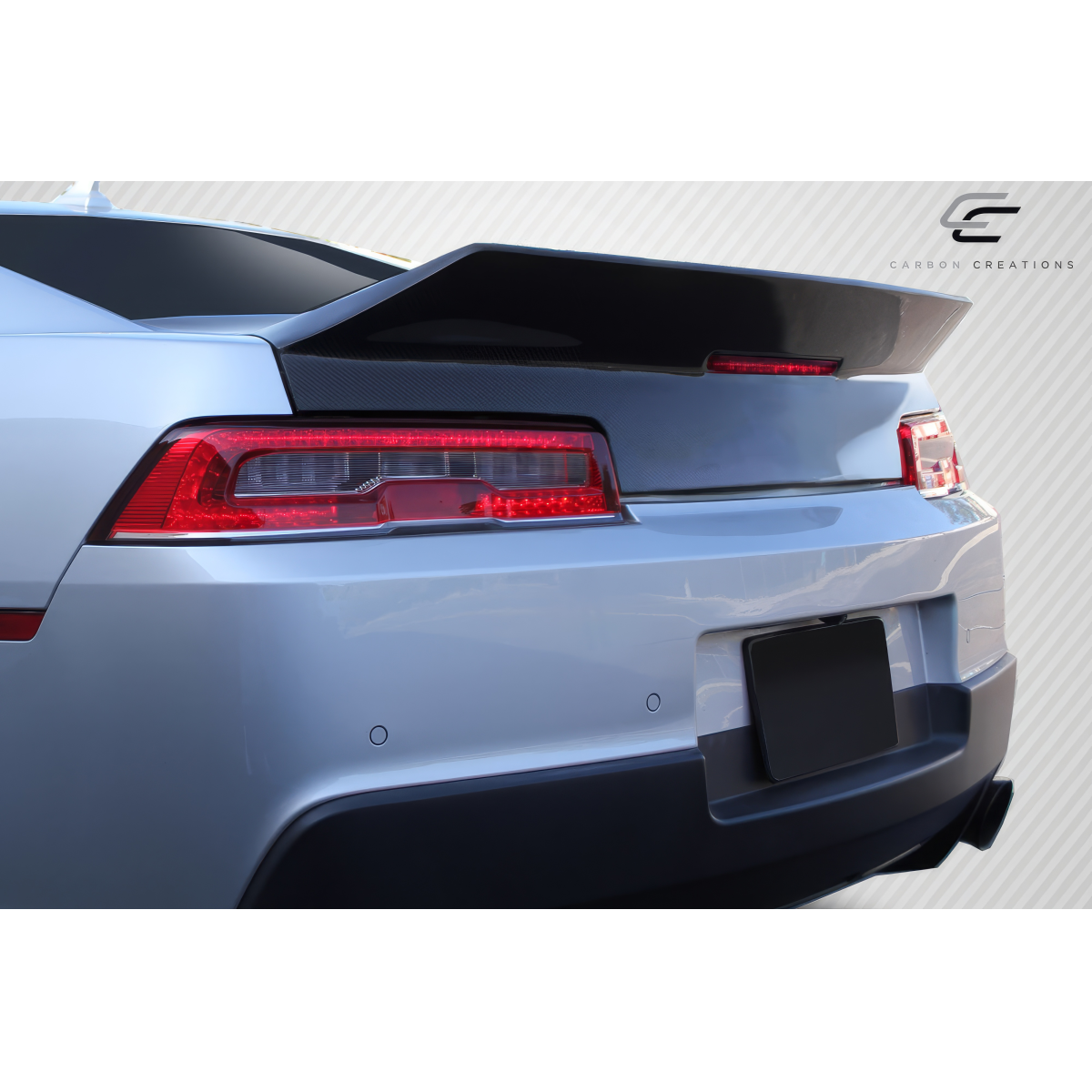 Modify your Chevrolet Camaro 2014 with our Exterior/Trunks - Rear angle view of car trunk with spoiler