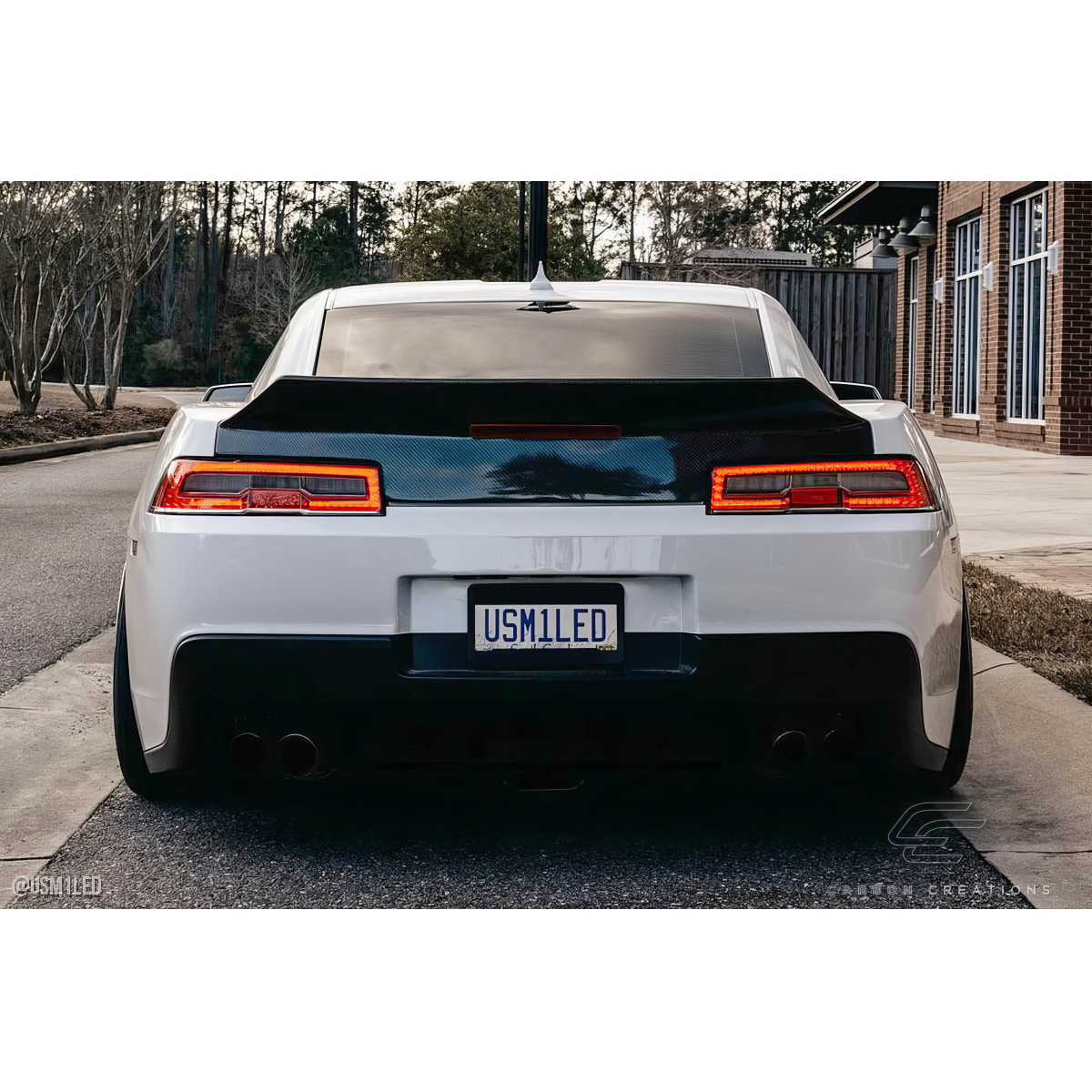 Modify your Chevrolet Camaro 2014 with our Exterior/Trunks - Rear view angle of the vehicle showing the trunk