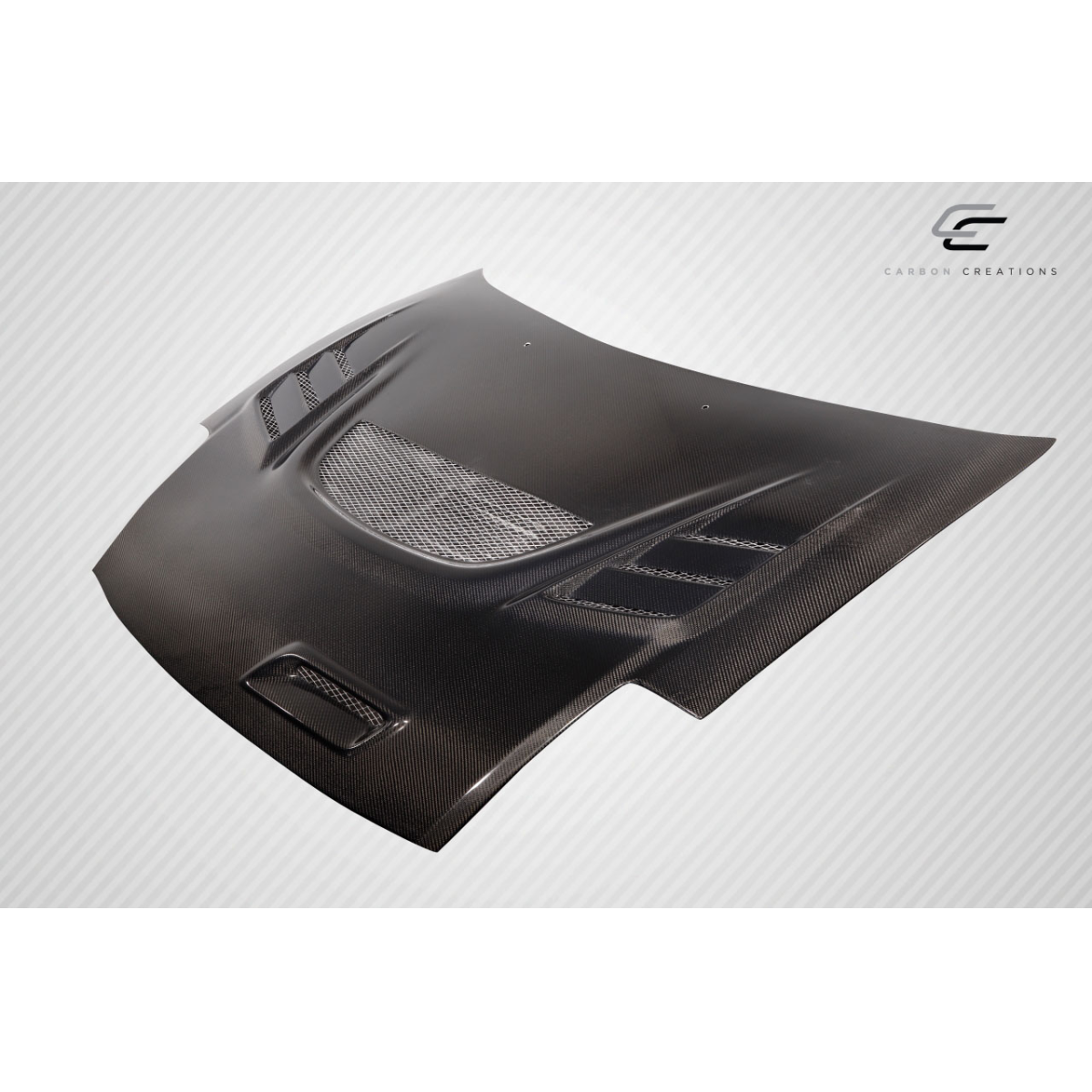 Modify your Mitsubishi Eclipse 2000 with our Exterior/Hoods - Angled view of a carbon fiber hood part