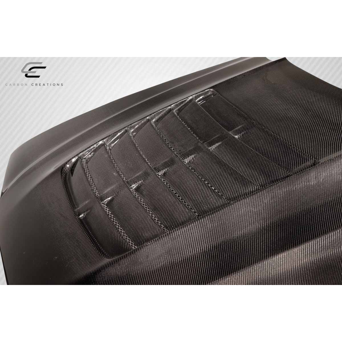 Modify your Ford Mustang 1994 with our Exterior/Hoods - Angled view showcasing carbon fiber texture and design