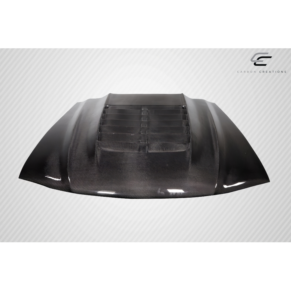 Modify your Ford Mustang 1994 with our Exterior/Hoods - Front view of carbon fiber hood at slight angle