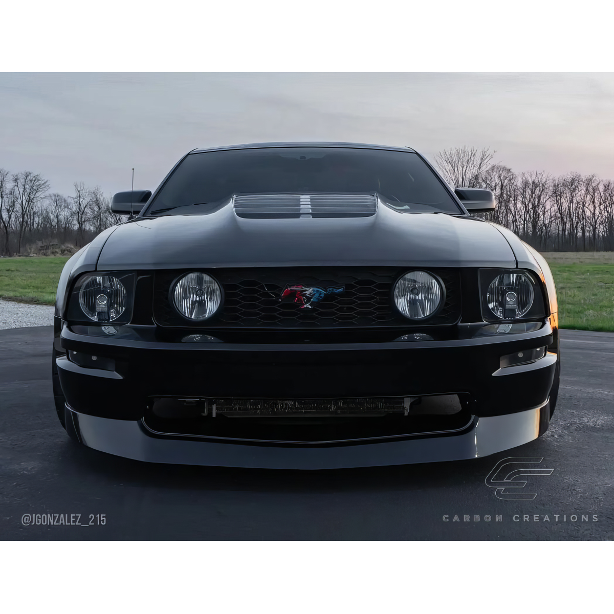 Modify your Ford Mustang 2005 with our Exterior/Hoods - Front view of vehicle from low angle