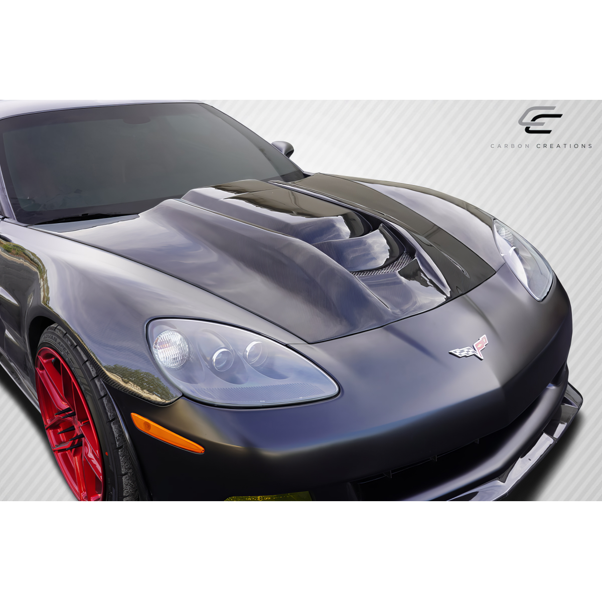 Modify your Chevrolet Corvette 2005 with our Exterior/Hoods - Front angle view of a carbon fiber hood