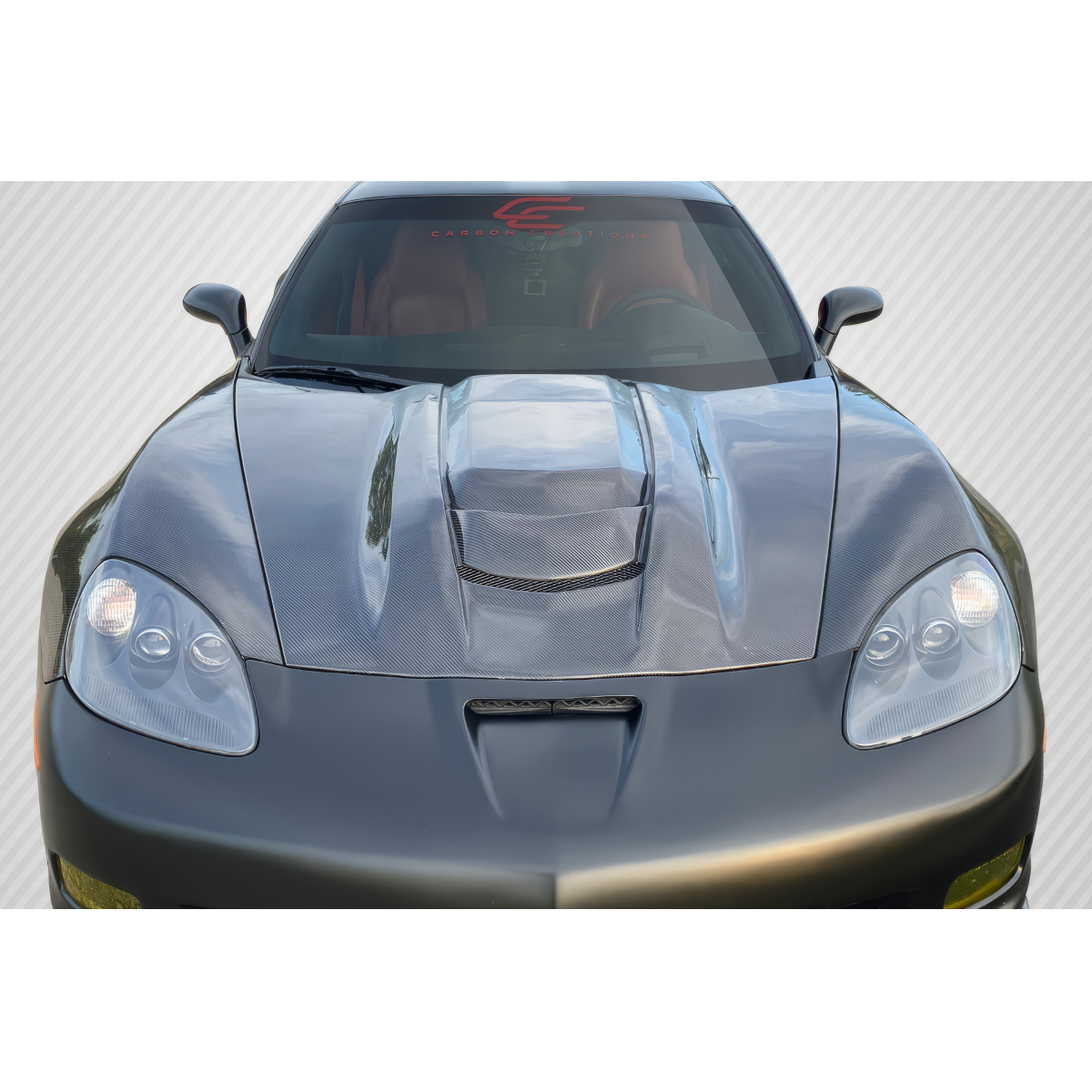 Modify your Chevrolet Corvette 2005 with our Exterior/Hoods - Front view of carbon fiber hood at slight angle