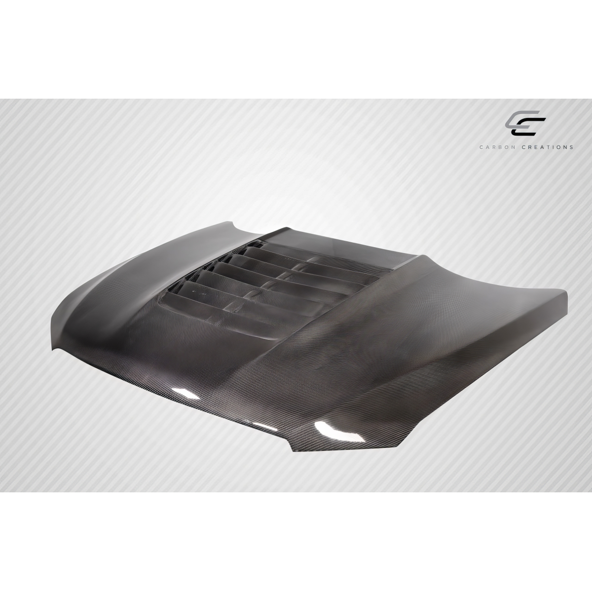 Modify your Ford Taurus 2013 with our Exterior/Hoods - Angled view of a carbon fiber hood part