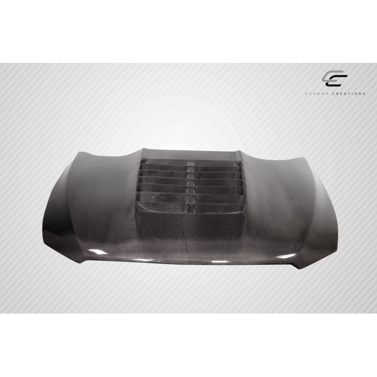 Modify your Ford Taurus 2013 with our Exterior/Hoods - Front angle view of carbon fiber hood