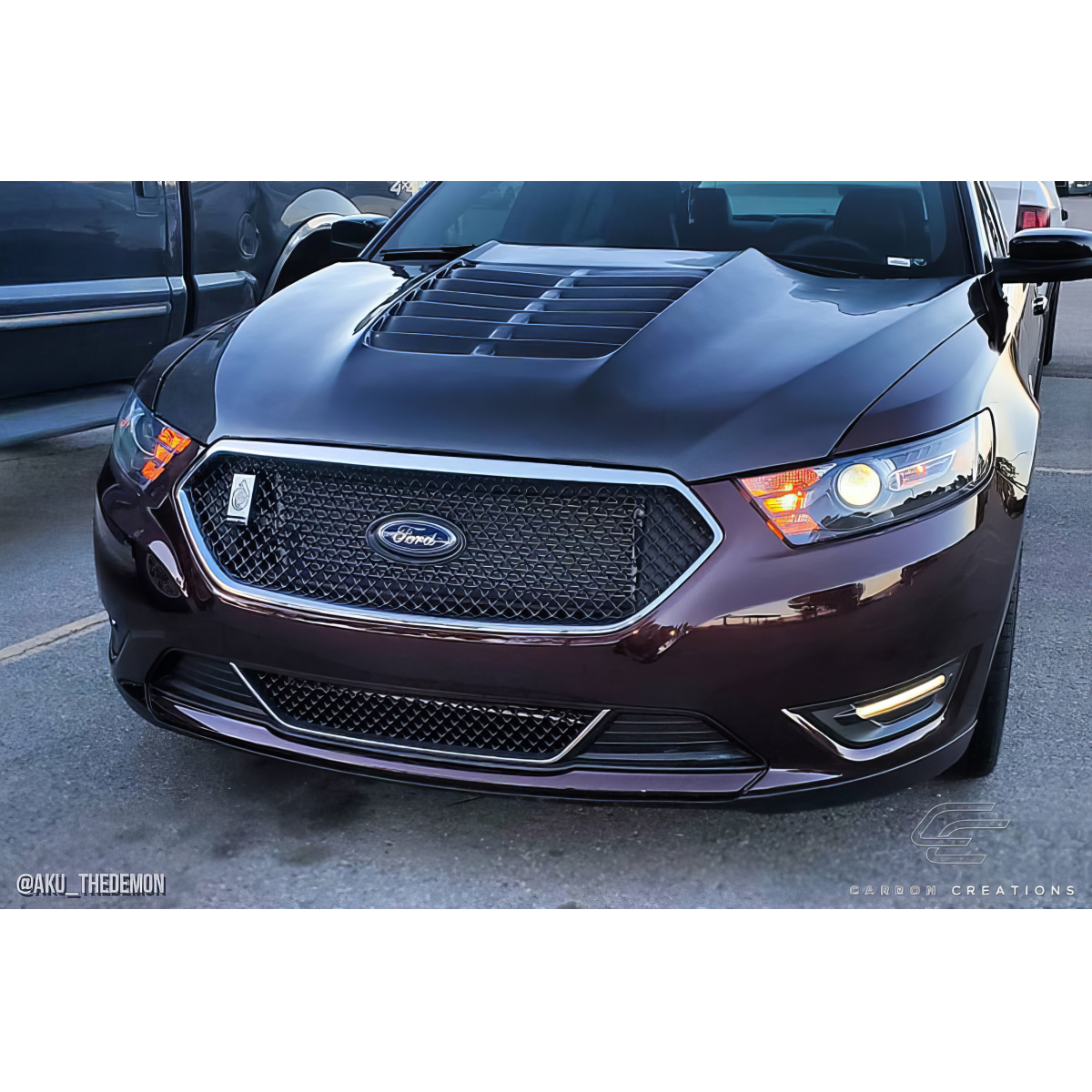 Modify your Ford Taurus 2013 with our Exterior/Hoods - Front angle view of the vehicle hood