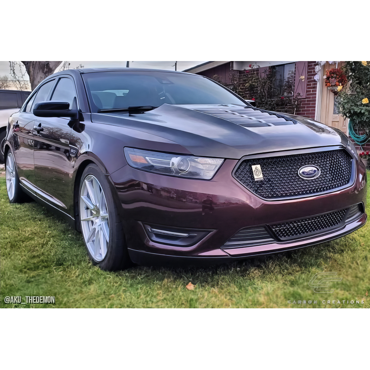 Modify your Ford Taurus 2013 with our Exterior/Hoods - Front three quarter angle view of vehicle