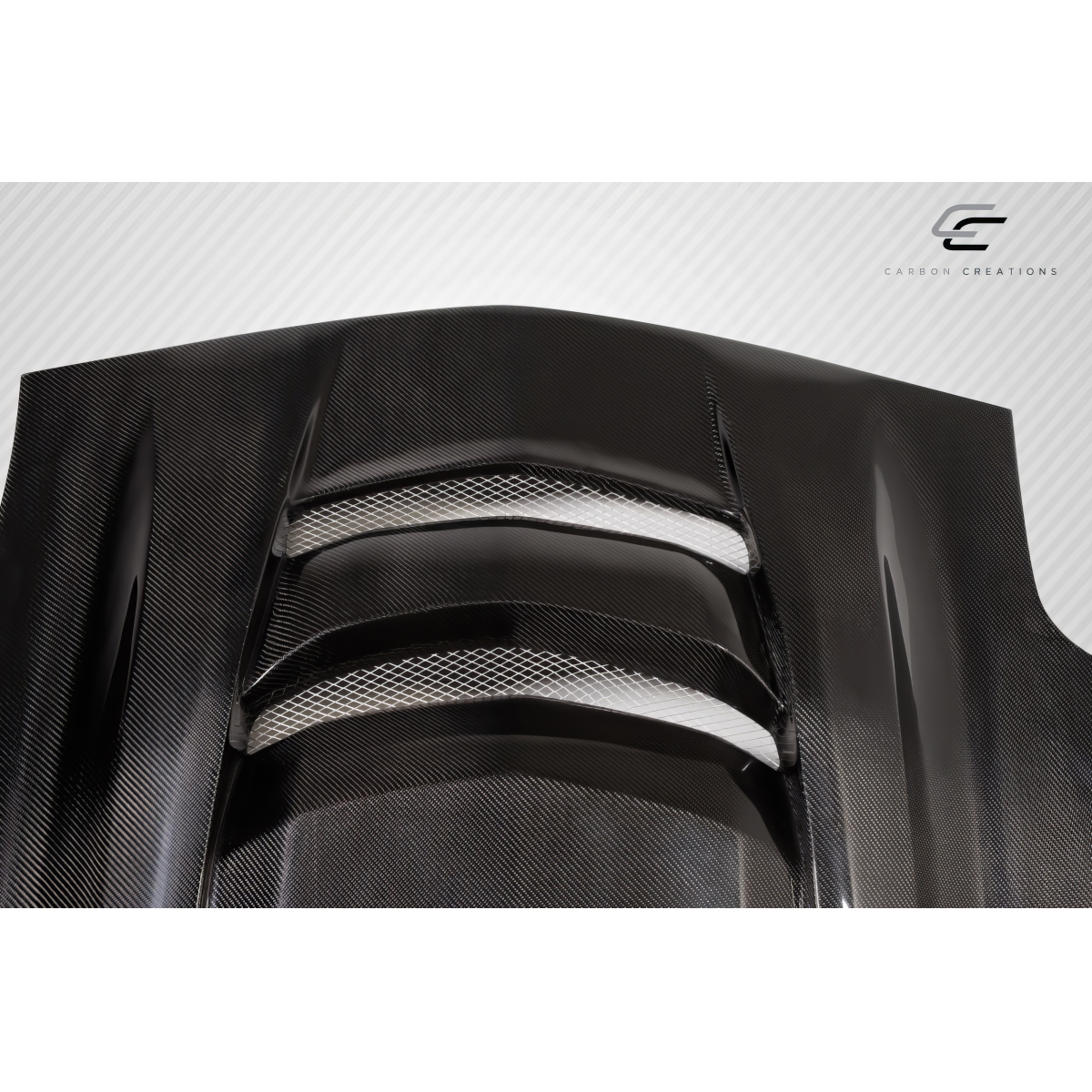 Modify your Chevrolet Corvette 1997 with our Exterior/Hoods - Angled view of a carbon fiber hood part