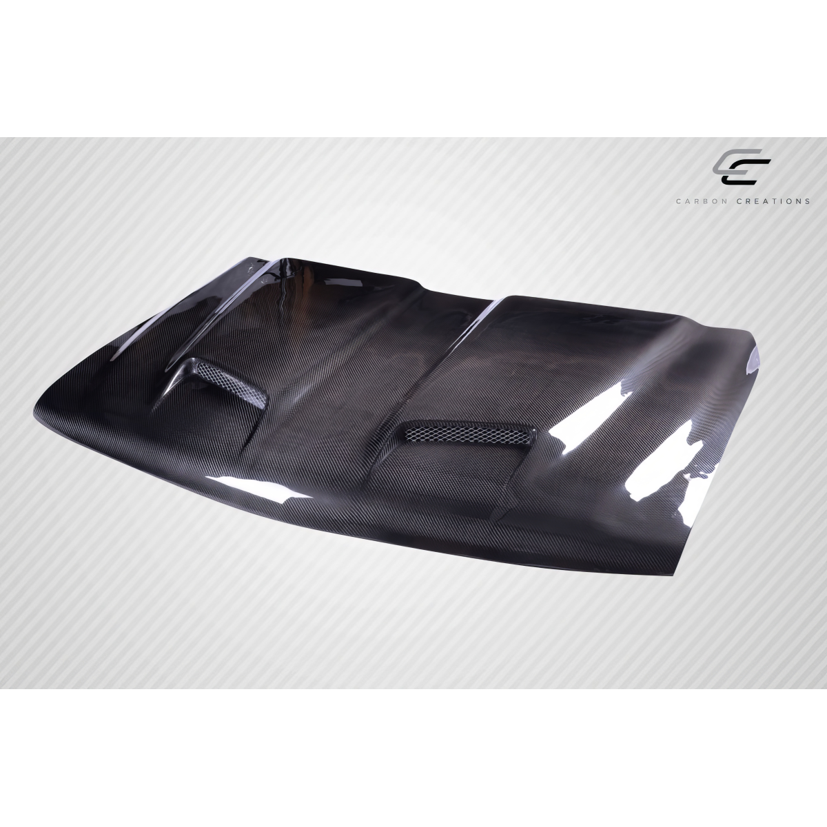 Modify your Chevrolet Silverado 1999 with our Exterior/Hoods - Angled view showing carbon fiber hood design