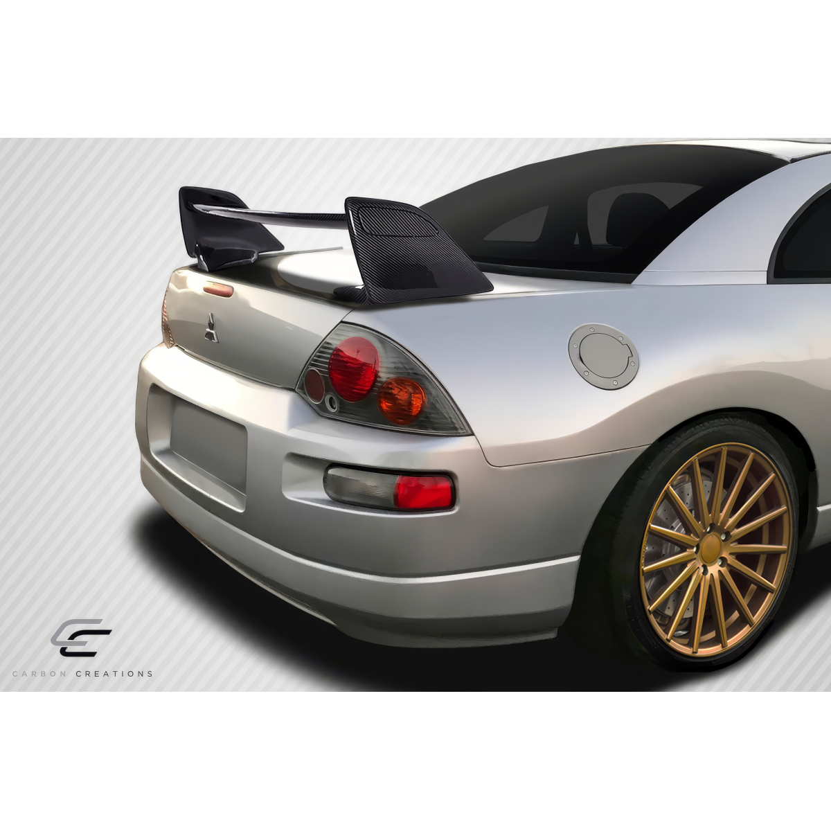 Modify your Mitsubishi Eclipse 2000 with our Exterior/Wings - Rear angle showcasing carbon fiber wing design