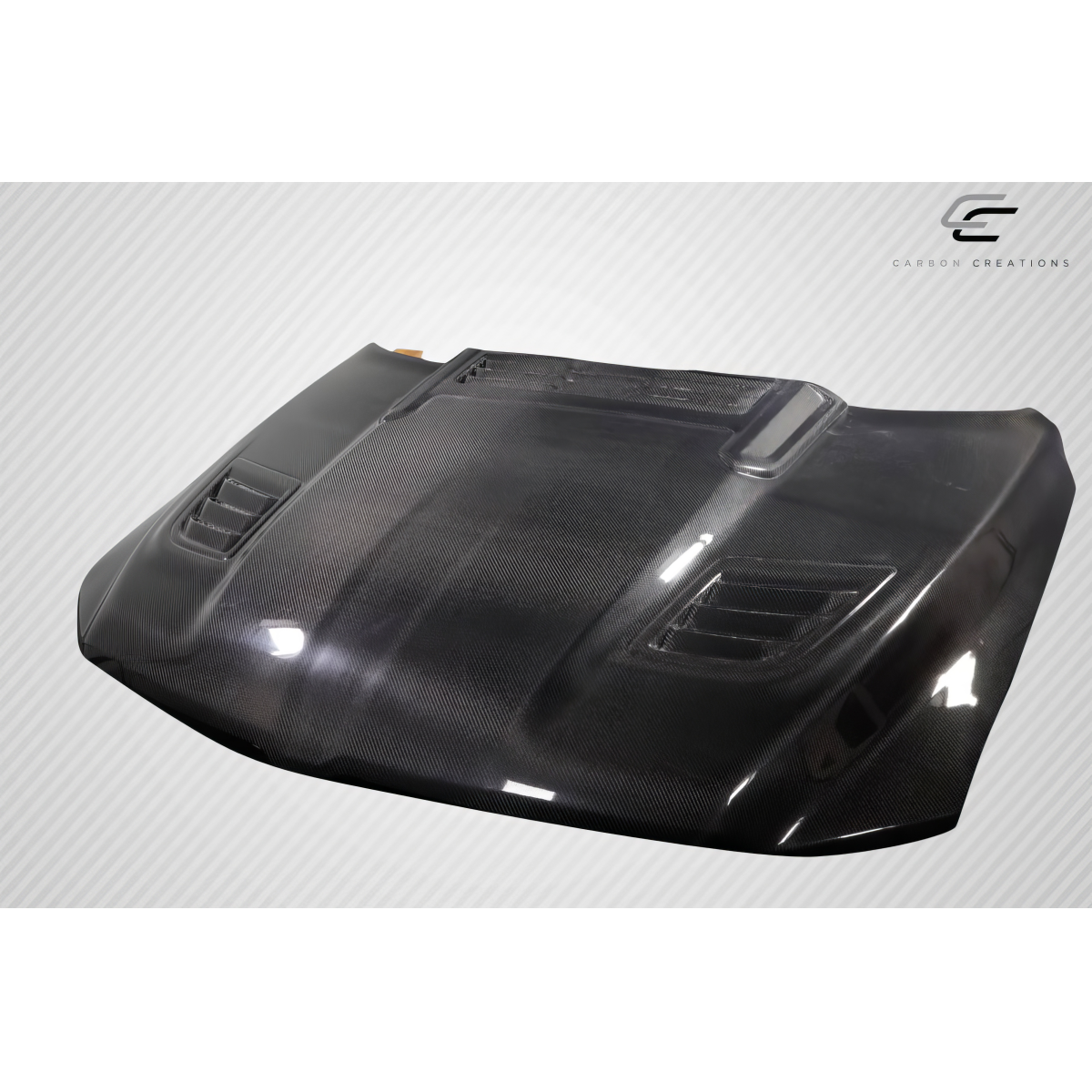 Modify your Dodge Ram 2019 with our Exterior/Hoods - Angled view showcasing carbon fiber hood design