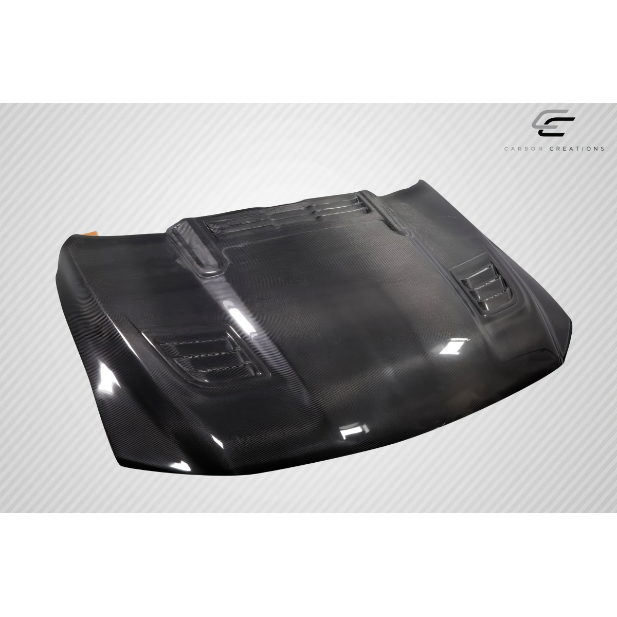 Modify your Dodge Ram 2019 with our Exterior/Hoods - Angled view showing the carbon fiber hood design