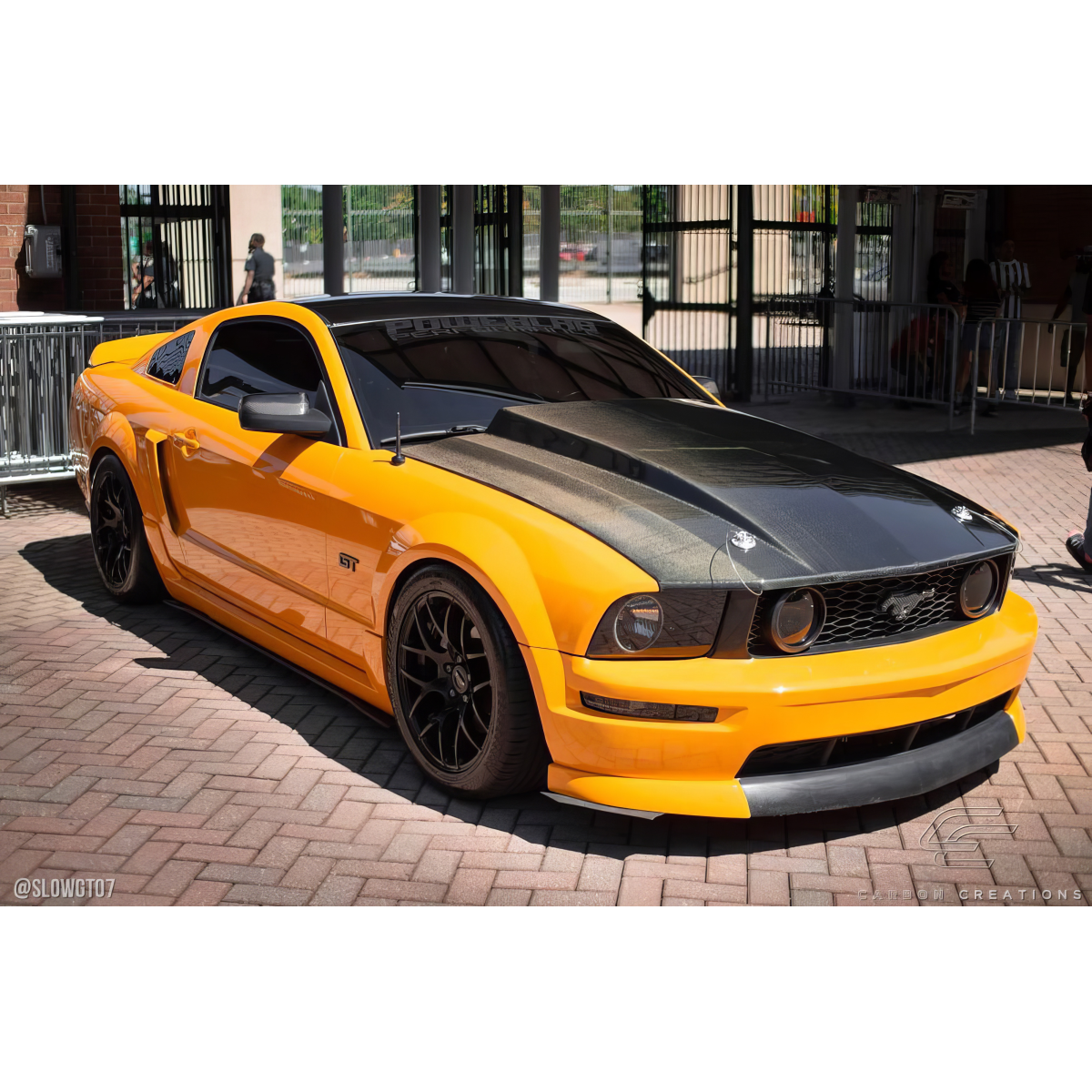 Modify your Ford Mustang 2005 with our Exterior/Hoods - Front angle showing cowl hood and body details