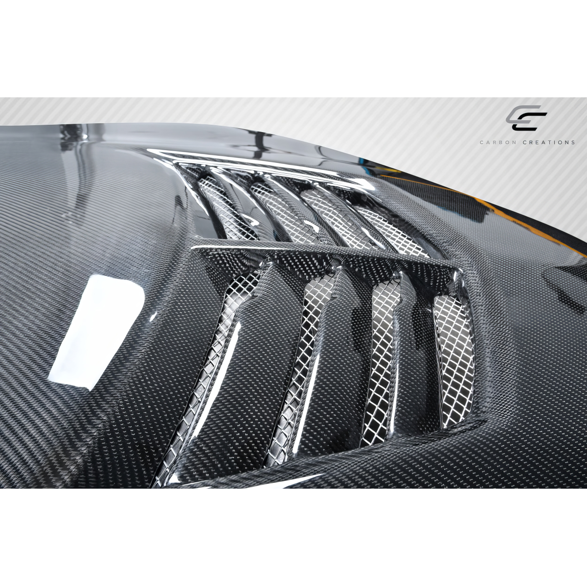 Modify your Pontiac Grand Prix 2004 with our Exterior/Hoods - Top angle view of carbon fiber hood details