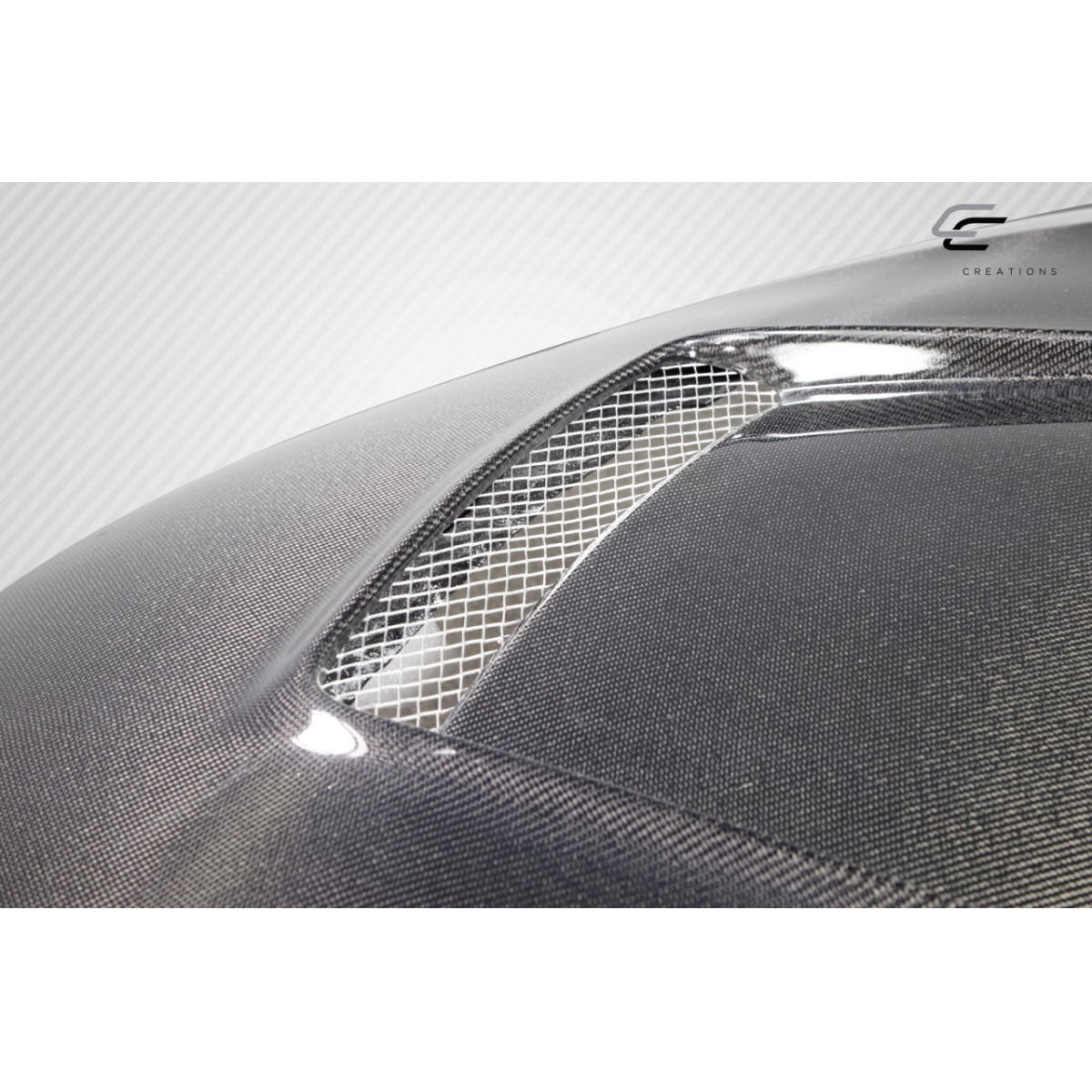 Modify your Toyota Corolla 2014 with our Exterior/Hoods - Angled view of carbon fiber hood feature