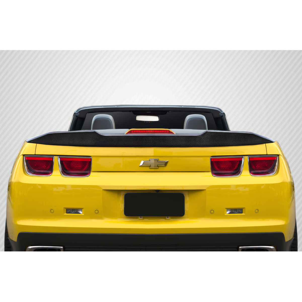 Modify your Chevrolet Camaro 2010 with our Exterior/Wings - Rearview angle of a yellow Camaro convertible