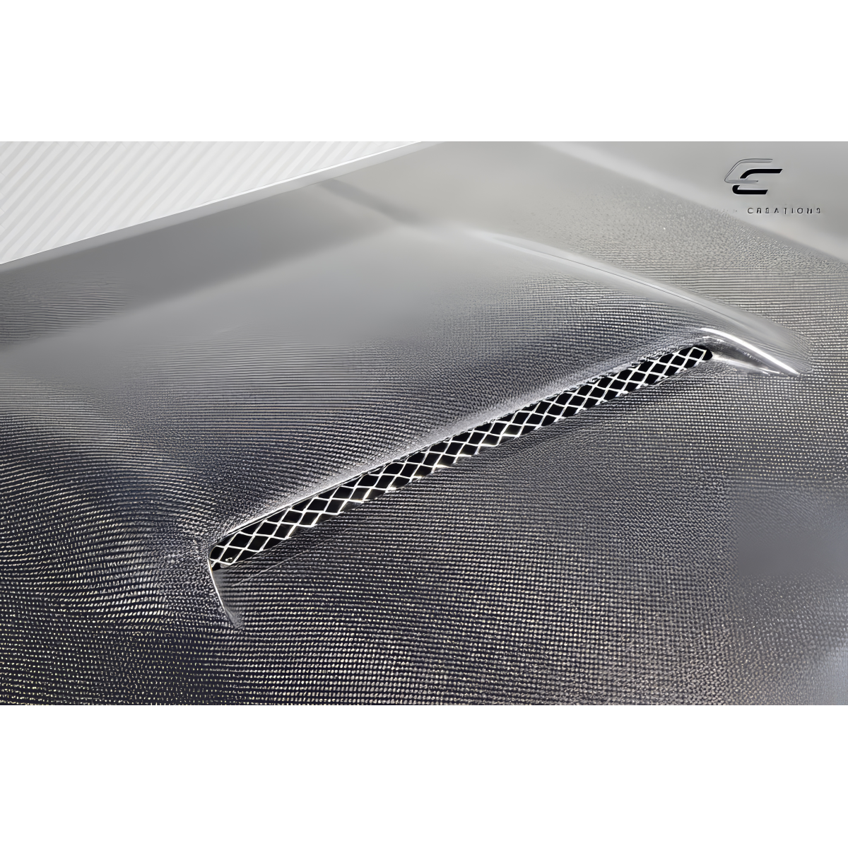 Modify your Toyota 4Runner 2010 with our Exterior/Hoods - Angled view of carbon fiber hood inlet