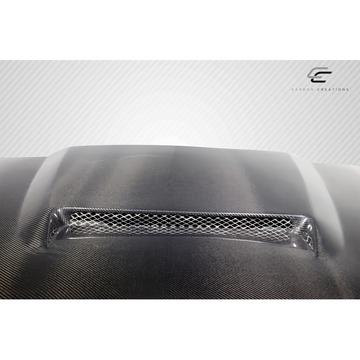 Modify your Toyota Tacoma 2016 with our Exterior/Hoods - Top view of carbon fiber hood with mesh vent