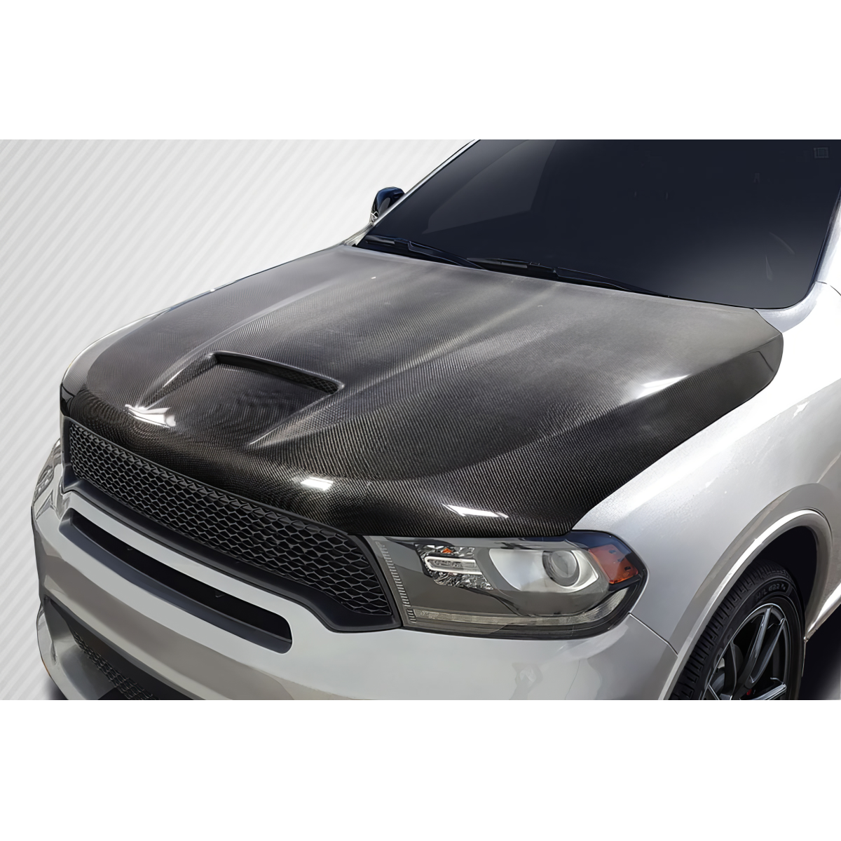 Modify your Dodge Durango 2011 with our Exterior/Hoods - Front angled view of carbon fiber hood