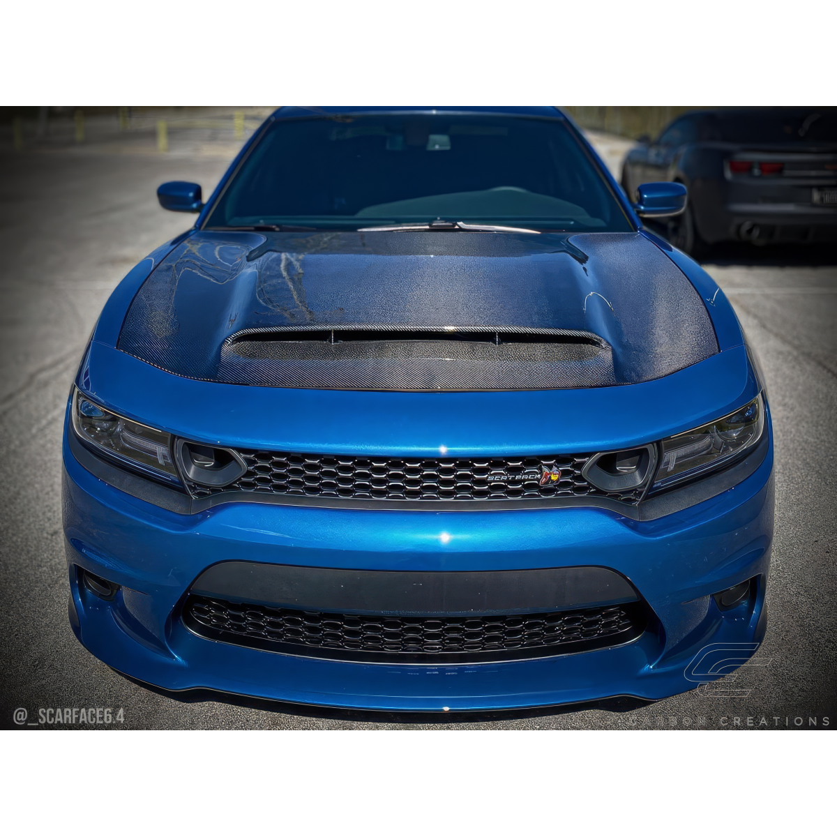 Modify your Dodge Charger 2015 with our Exterior/Hoods - Front angle view of the Dodge Charger