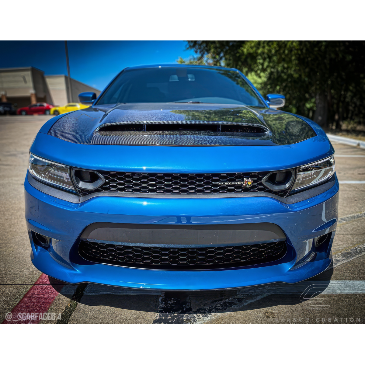 Modify your Dodge Charger 2015 with our Exterior/Hoods - Front view at a low angle focused on hood