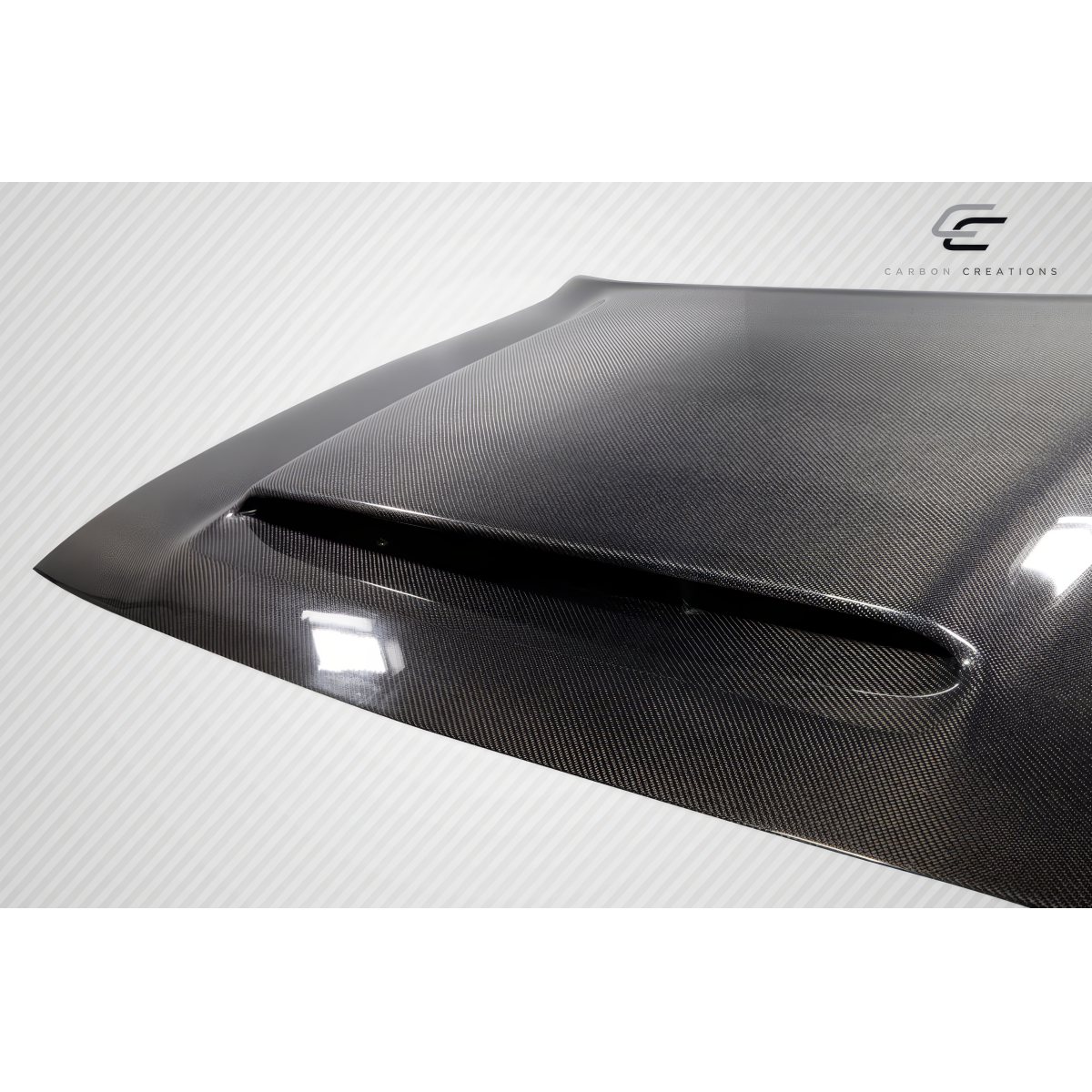 Modify your Dodge Challenger 2008 with our Exterior/Hoods - Angled view showing carbon fiber hood design