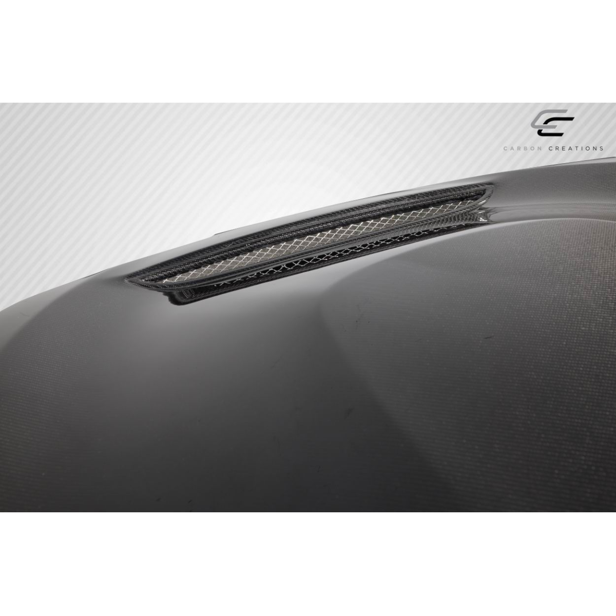 Modify your BMW 3-Series 2012 with our Exterior/Hoods - Top angle featuring carbon fiber texture