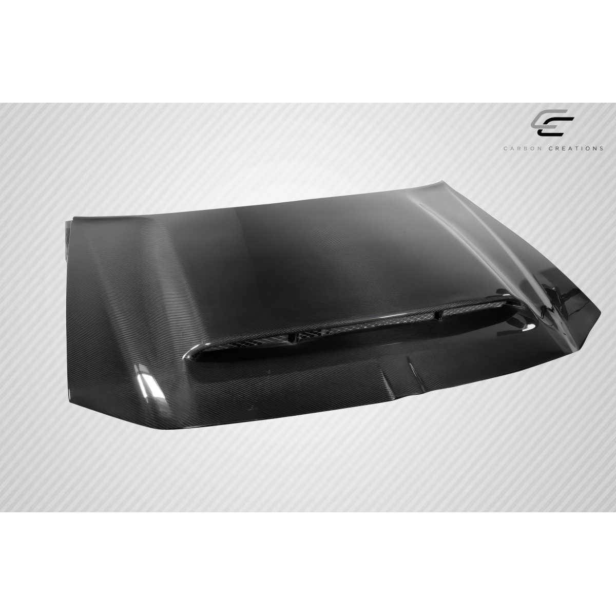 Modify your Dodge Magnum 2005 with our Exterior/Hoods - Angled view highlighting the carbon fiber texture