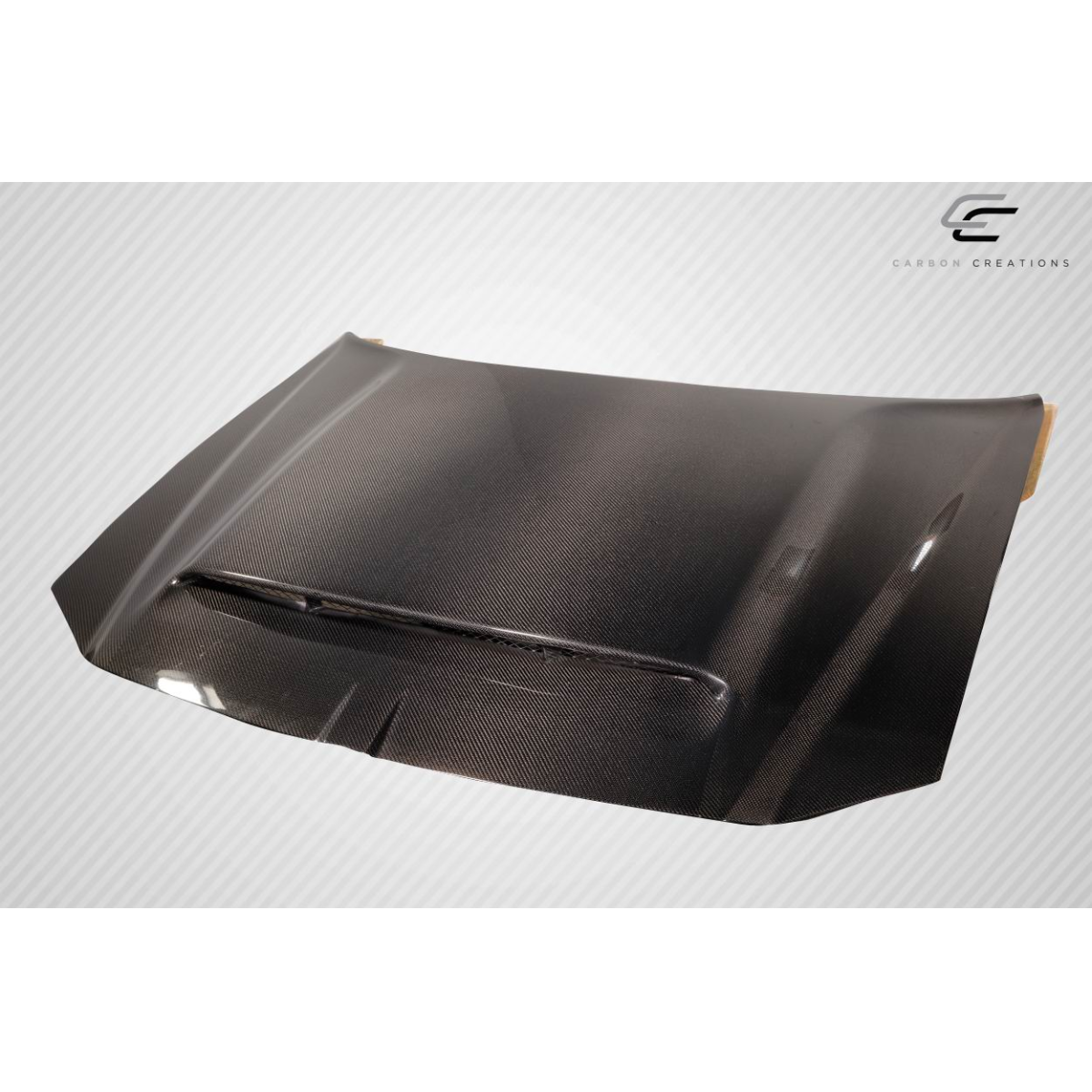 Modify your Dodge Magnum 2005 with our Exterior/Hoods - Front view angle of a carbon fiber hood