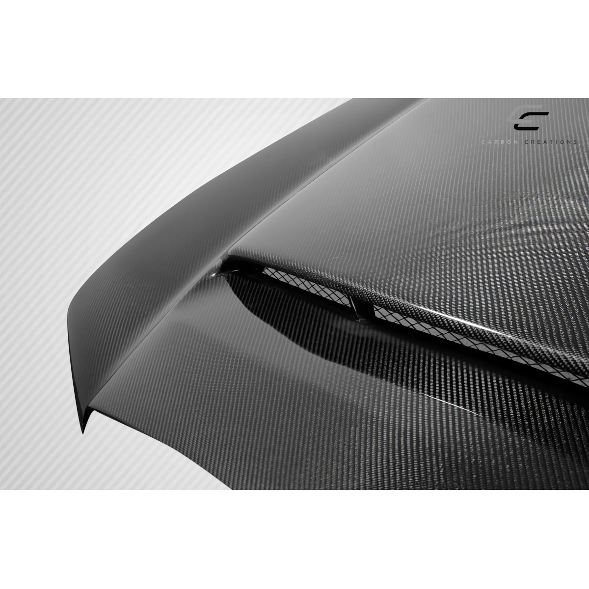 Modify your Dodge Charger 2011 with our Exterior/Hoods - Angled view of carbon fiber hood component