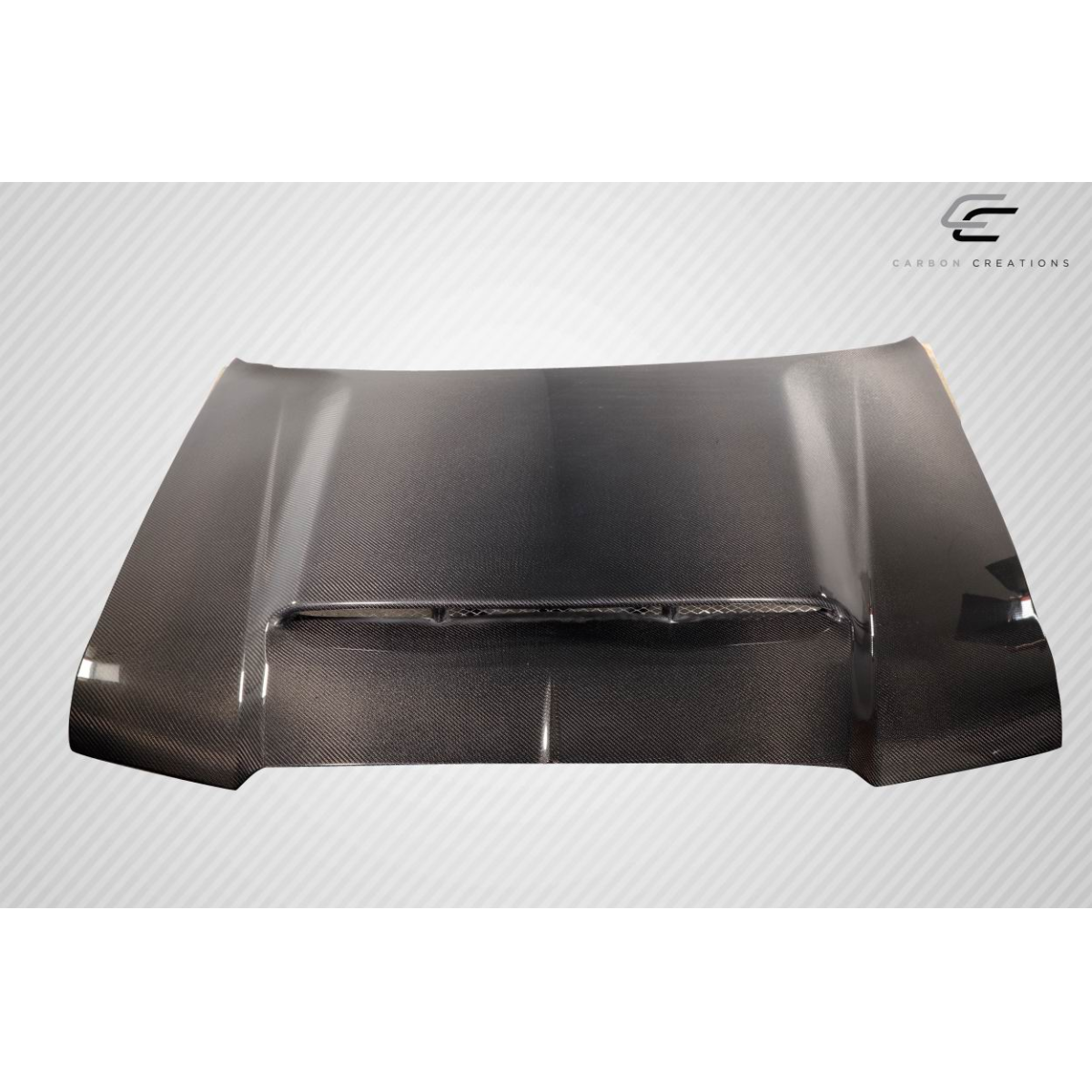 Modify your Chrysler 300 2005 with our Exterior/Hoods - Front angled view of carbon fiber hood