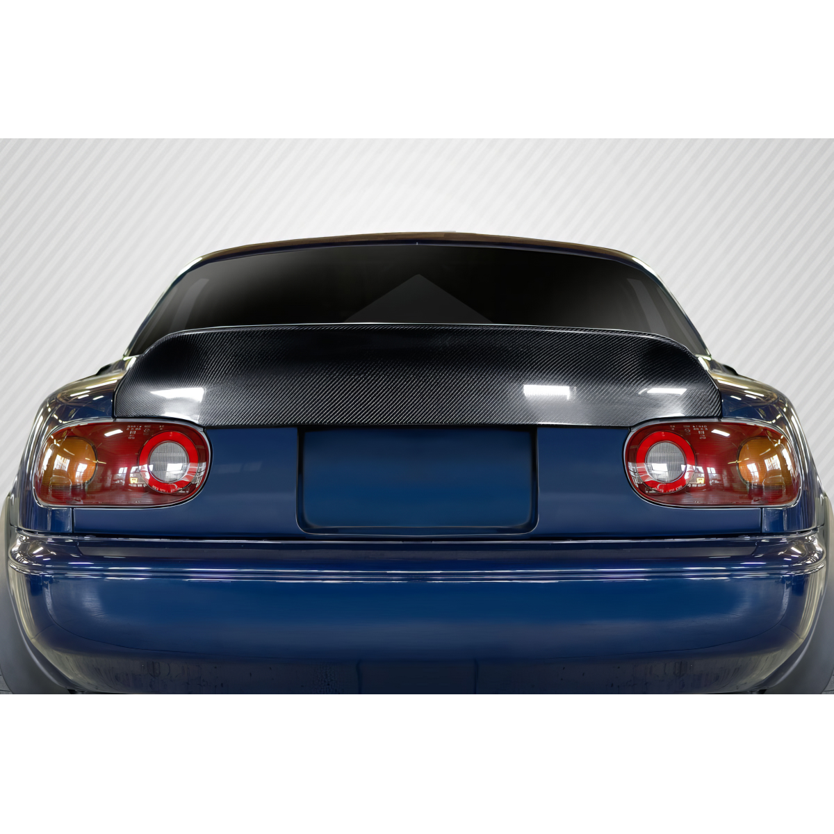 Modify your Mazda Miata 1990 with our Exterior/Rear Bumpers - View of the rear of the car from a straight angle
