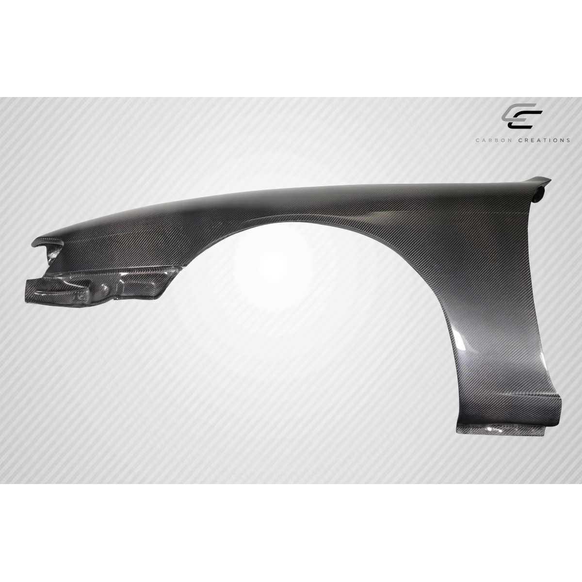 Modify your Nissan 240SX 1997 with our Exterior/Fenders - Angled side view of a carbon fiber fender