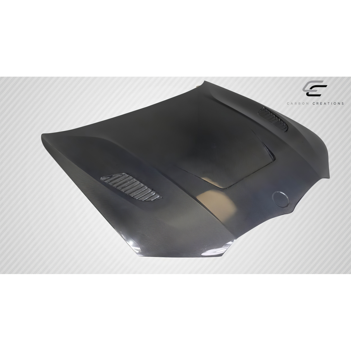 Modify your BMW 3-Series 2019 with our Exterior/Hoods - Angled view of a carbon fiber hood