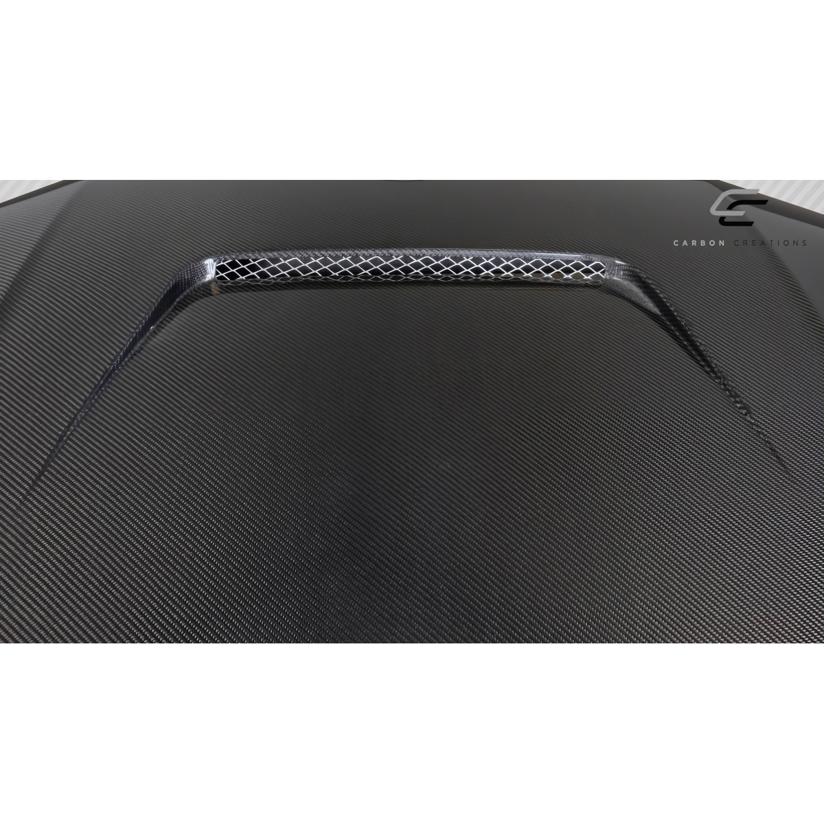 Modify your BMW 3-Series 2019 with our Exterior/Hoods - Top view at slight angle showing carbon fiber texture