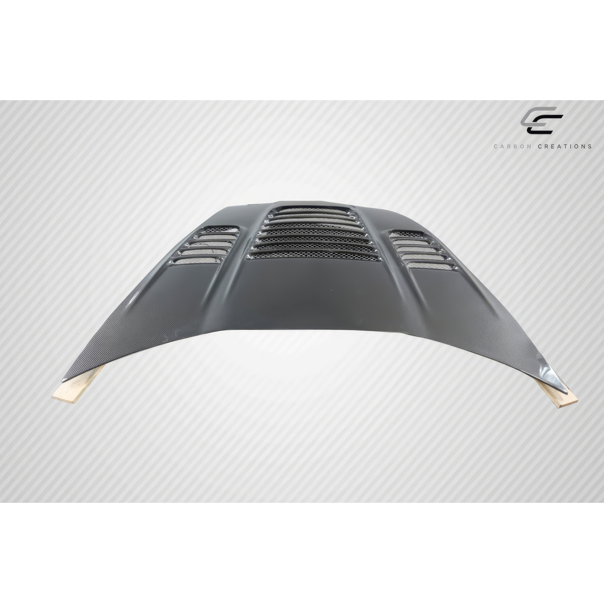 Modify your Chevrolet Corvette 2005 with our Exterior/Hoods - Angled view of a carbon fiber hood