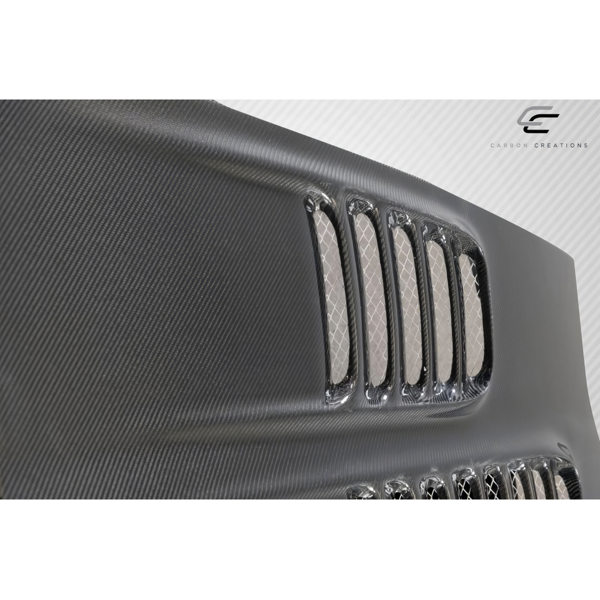 Modify your Chevrolet Corvette 2005 with our Exterior/Hoods - Angled view of carbon fiber hood with vents