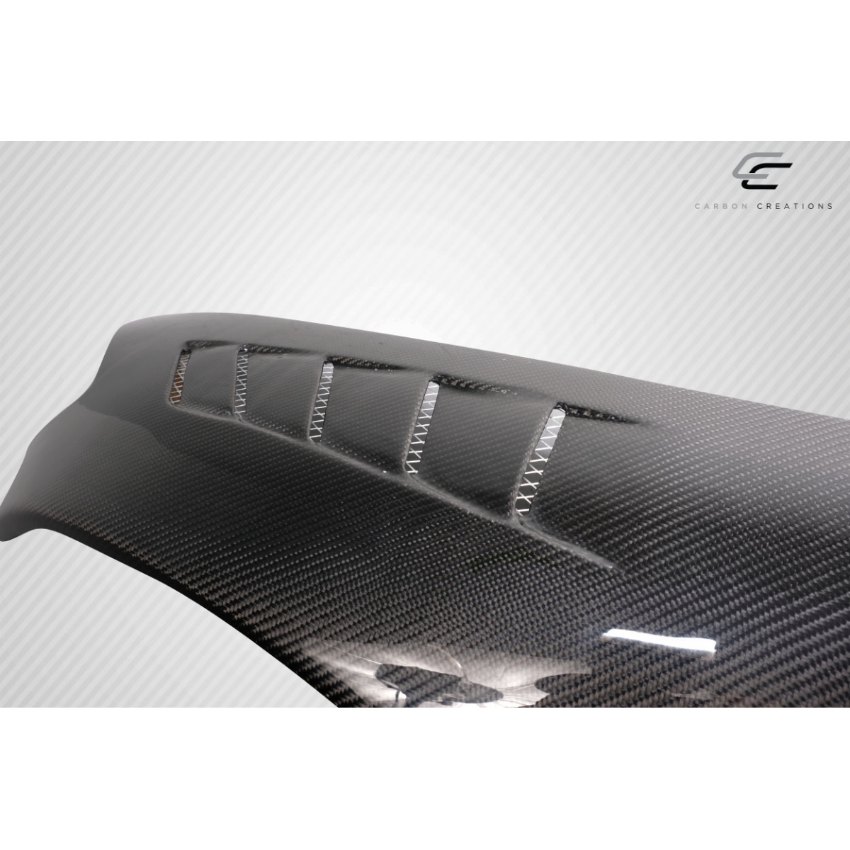 Modify your Honda S2000 2000 with our Exterior/Fenders - Angled view of a carbon fiber front fender part