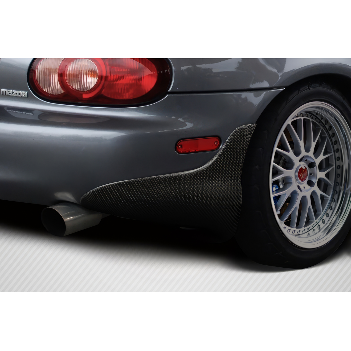 Modify your Mazda Miata 1999 with our Others - Rear view angle showing carbon fiber mud flap