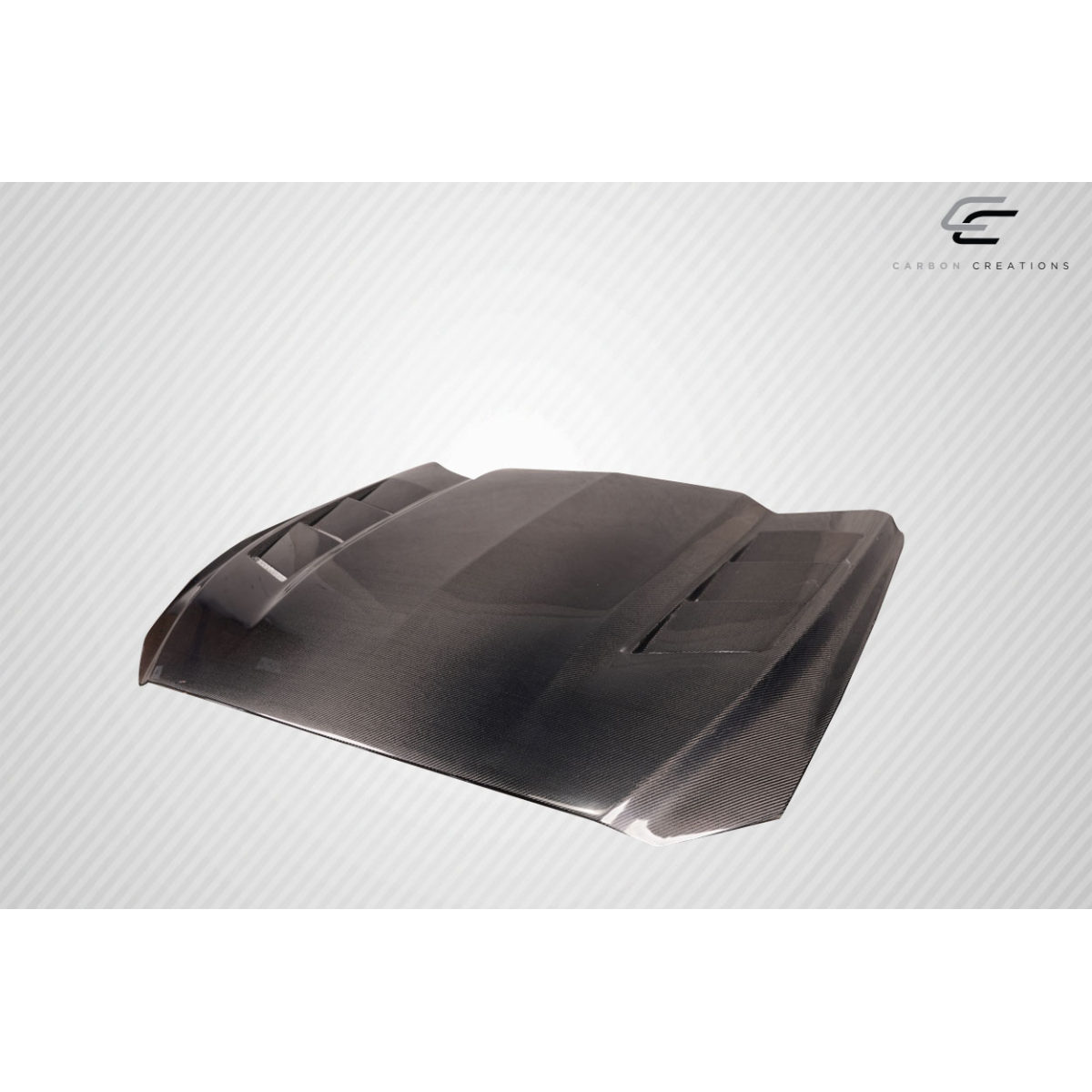 Modify your Ford Mustang 2015 with our Exterior/Hoods - Angled view of a carbon fiber hood showing details