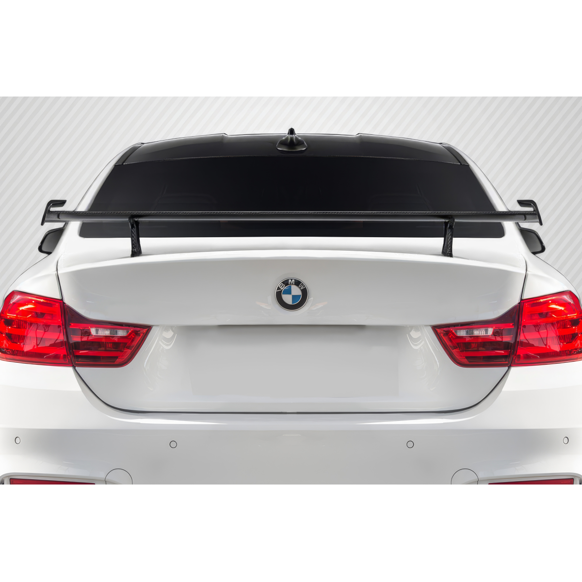 Modify your BMW M4 2014 with our Exterior/Wings - Rear view angle of BMW M4 with spoiler