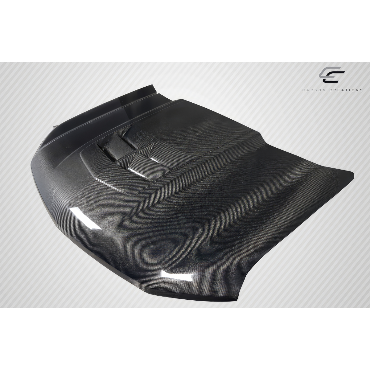 Modify your Chevrolet Silverado 1500 2019 with our Exterior/Hoods - Angled view showing carbon fiber hood design