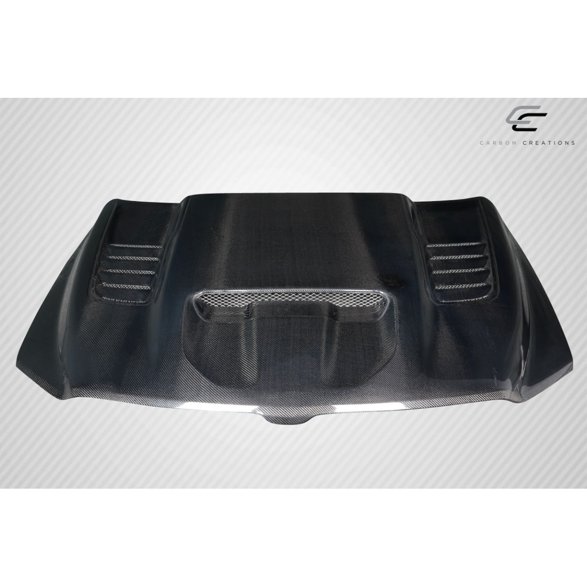 Modify your Dodge Ram 2019 with our Exterior/Hoods - Front top view of a carbon fiber hood