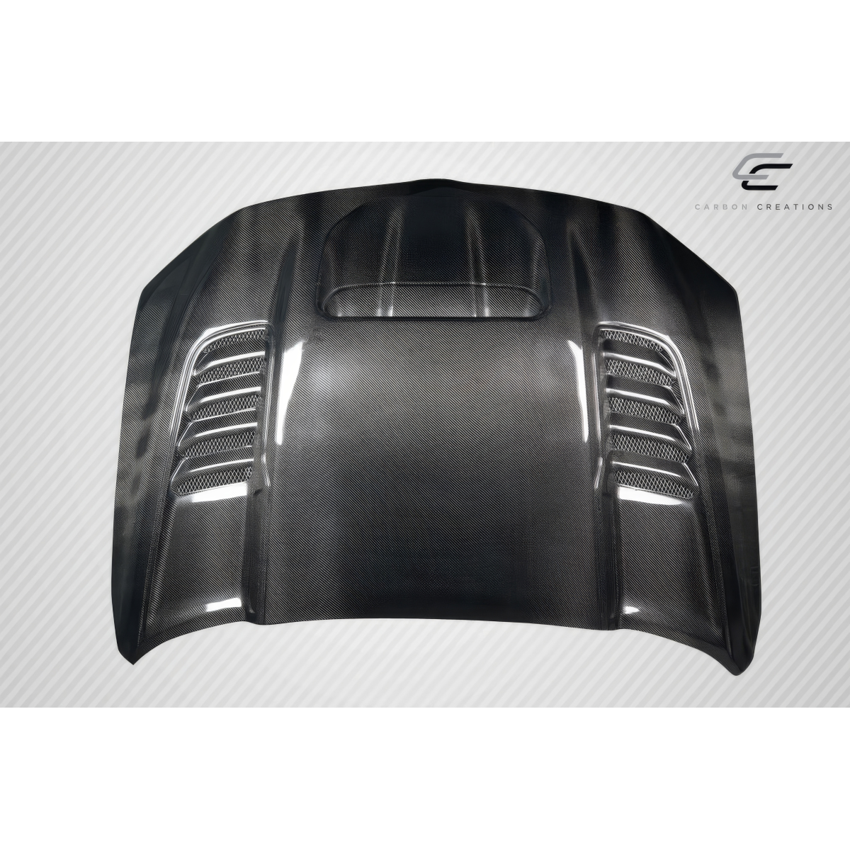 Modify your Dodge Ram 2019 with our Exterior/Hoods - Front view angled showing carbon fiber hood