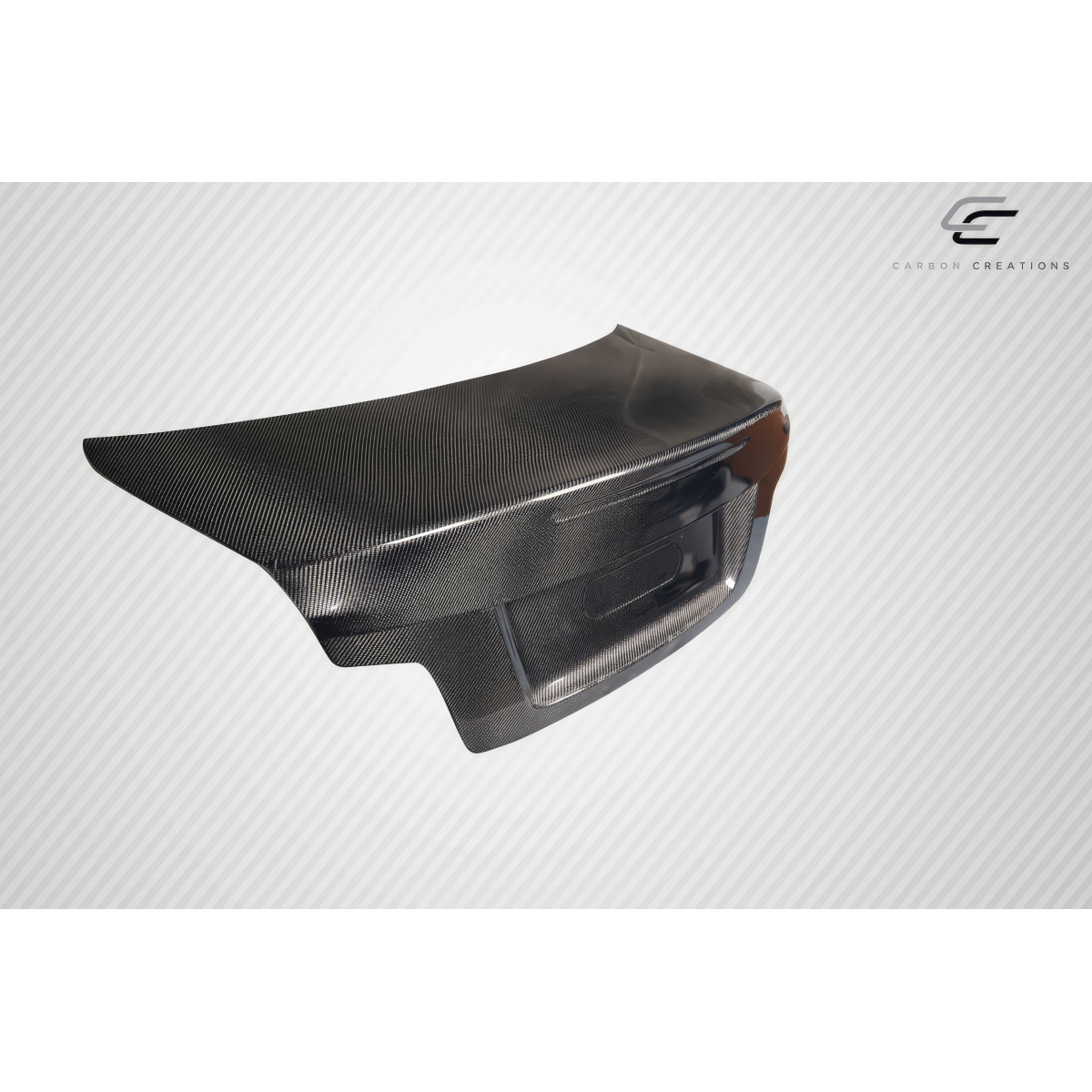Modify your BMW 1-Series 2008 with our Exterior/Trunks - Angle shows side view of carbon fiber trunk part
